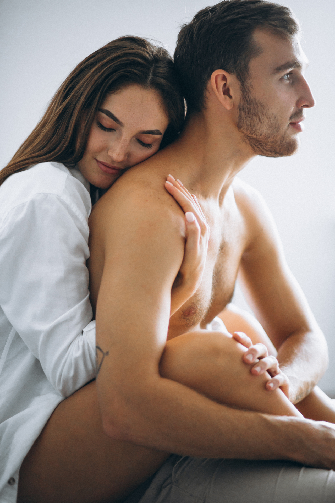 Confident strong man embracing vitality at sunrise